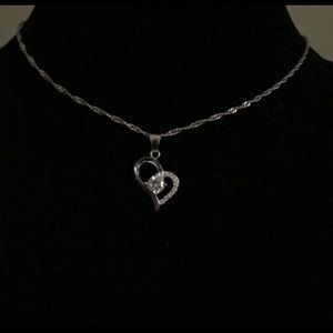 18” Sterling silver necklace with charm as seen.  New without tags. Never worn